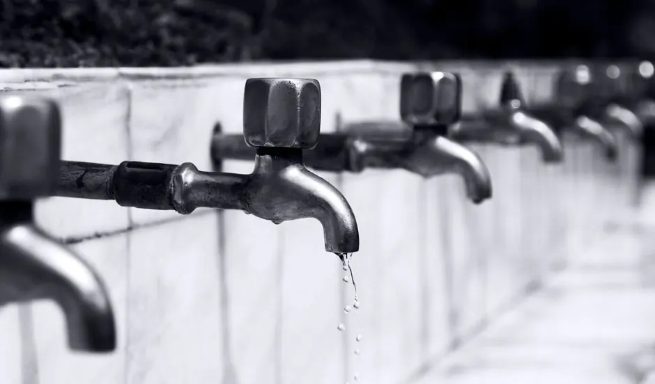 Row of dripping faucets